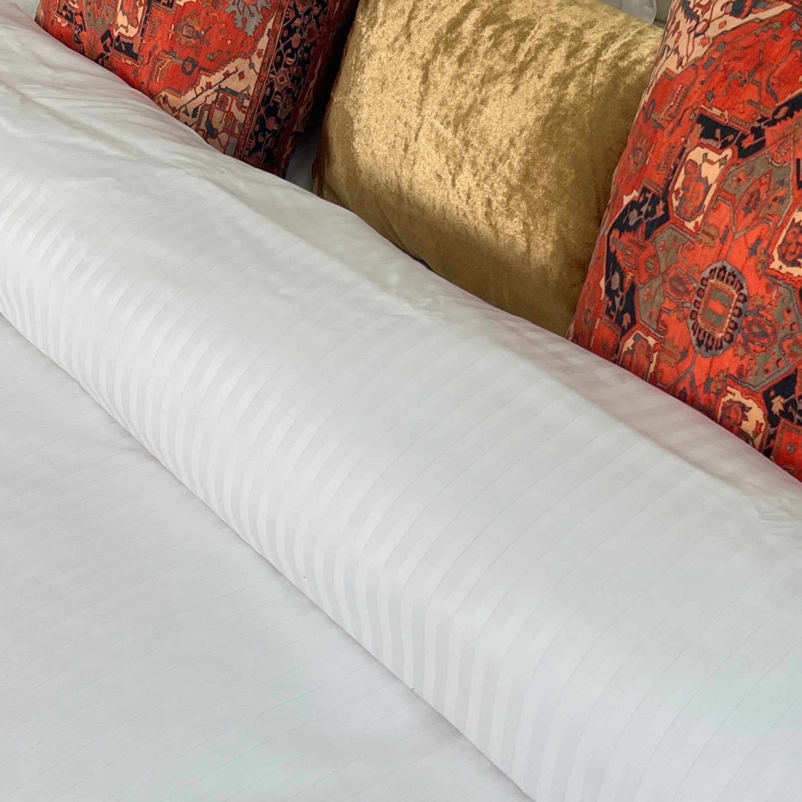 White-on-White Stripes Duvet Cover closeup on a beautifully made bed with pillows