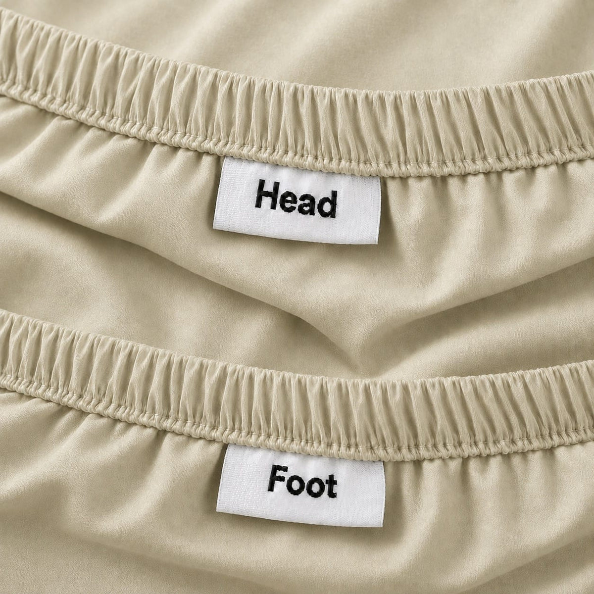 Beige fitted sheet with HEAD and FOOT orientation labels