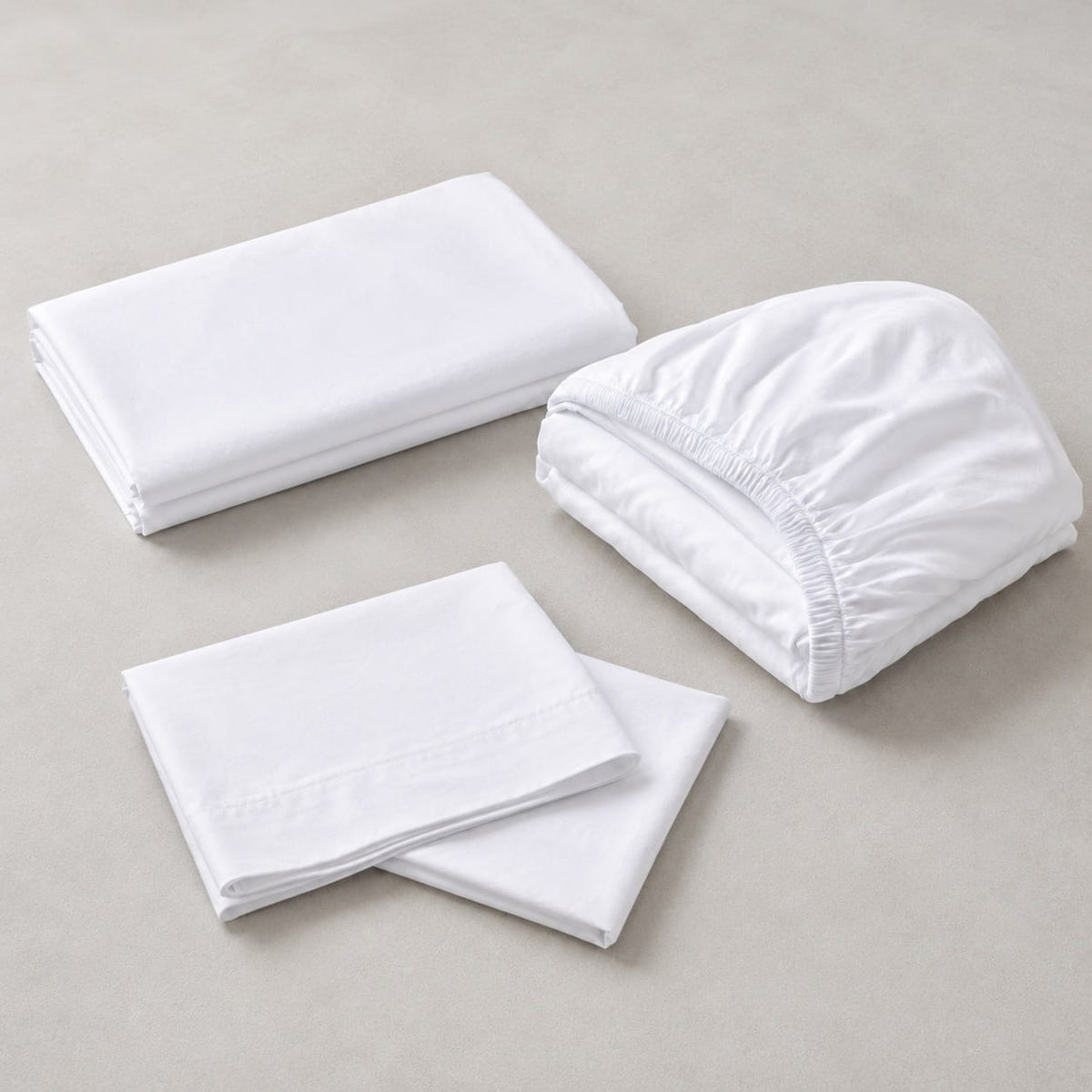 Folded Beddley White 4-piece 100% cotton sateen sheet set with two matching pillowcases