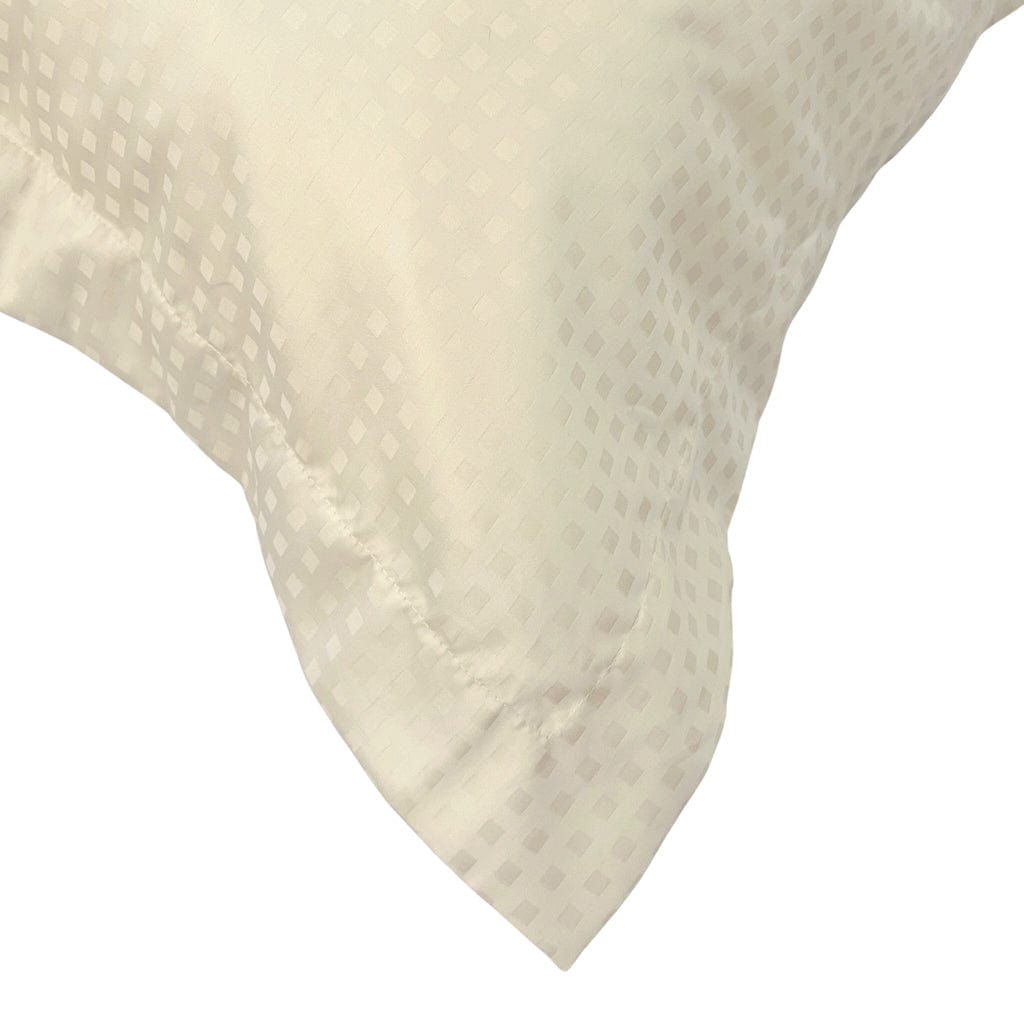 Close-up of a textured beige pillow on a white background