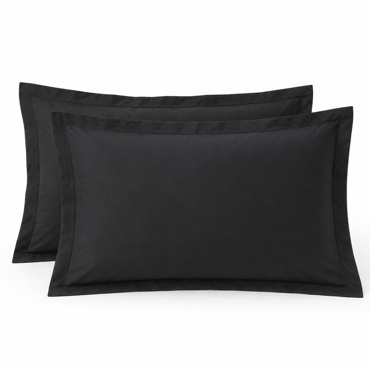 Black pillow shams shown as a matching pair