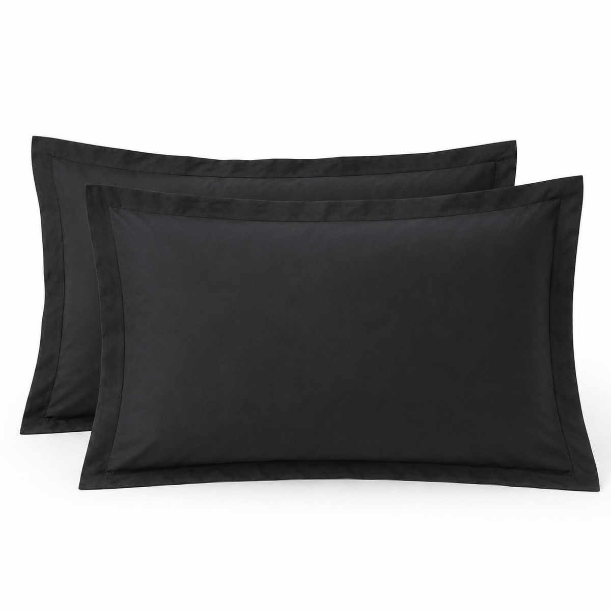 Black pillow shams shown as a matching pair